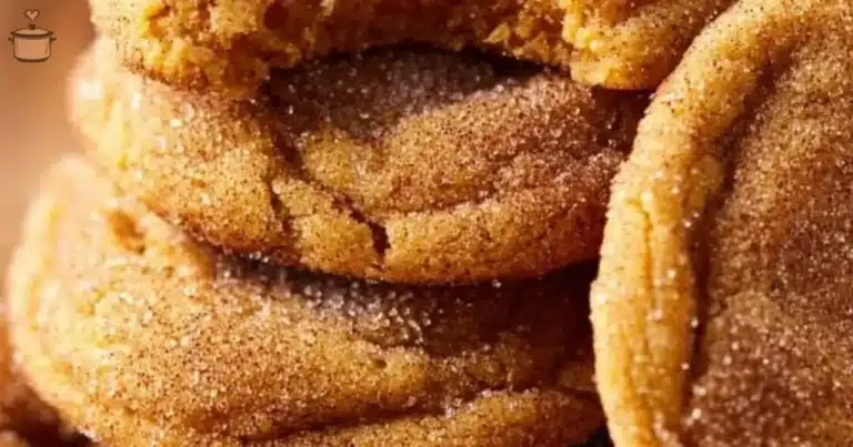 Chewy pumpkin snickerdoodle cookies with cinnamon and sugar on a baking tray.