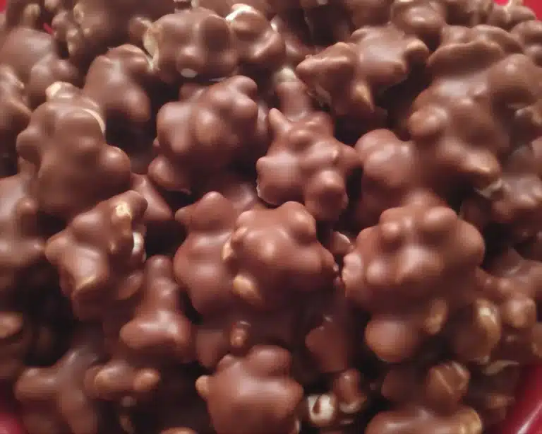 Delicious Crockpot Christmas Crack made with chocolate and peanuts cooked in a slow cooker.