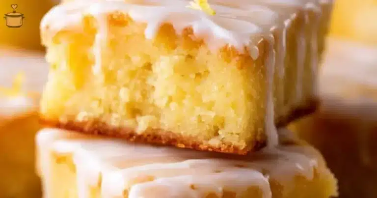 Delicious Lemon Brownies sprinkled with powdered sugar on a plate