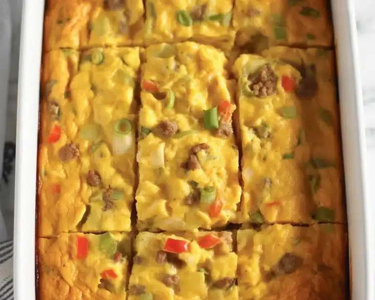 Delicious holiday breakfast casserole with eggs, sausage, and cheese.