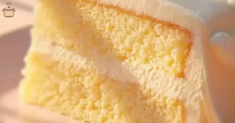 Soft and fluffy vanilla cake topped with cream and fresh berries