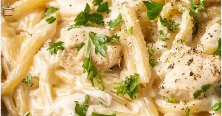 Creamy Crockpot Chicken Alfredo served in a bowl with parsley garnish