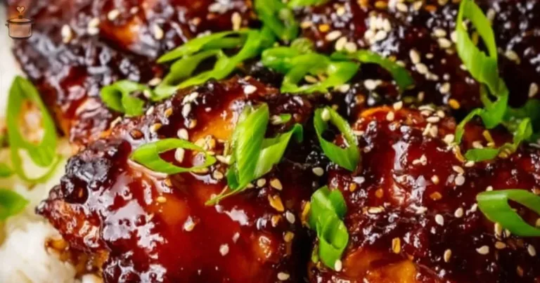 A plate of Slow Cooker Honey Garlic Chicken garnished with green onions.