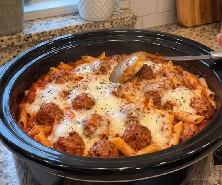 Cozy Crockpot Recipes 1 A delicious serving of Crockpot Meatball Penne with garnished herbs.