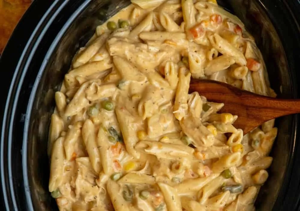 This Crock Pot Chicken Pot Pie Pasta combines tender chicken, creamy sauce, and veggies into one easy slow-cooker meal. … | Crockpot chicken breast recipes easy with pasta, Chicken and pasta crockpot recipes, Chicken pot pie pasta crock pot